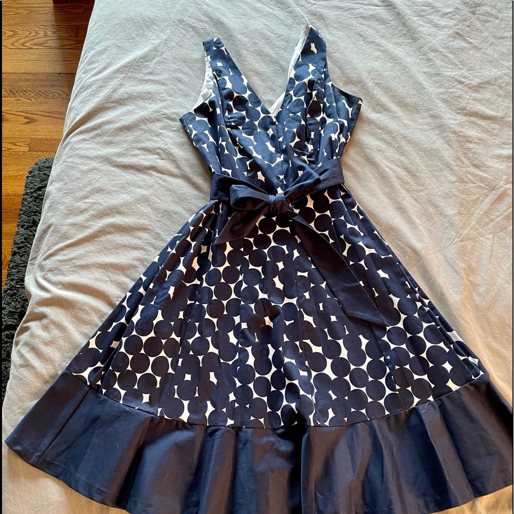 Navy blue polka dot sundress with sash. Size 12. In perfect condition.